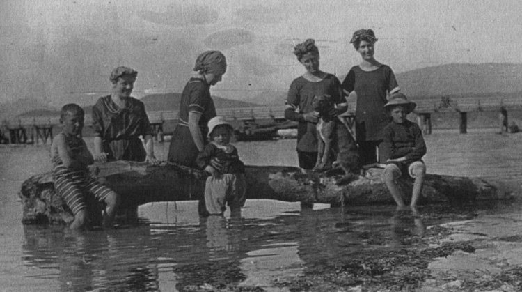 "High fashion swimwear in 1915. Me  in stripes, Laurencia Herchmer in the bloomers, Mother with the dog, Miss [Ethel] Burpee next to her." 
(Source: Spilsbury's Coast by Howard White and Jim Spilsbury, Harbour Publishing, 1987, www.harbourpublishing.com)
