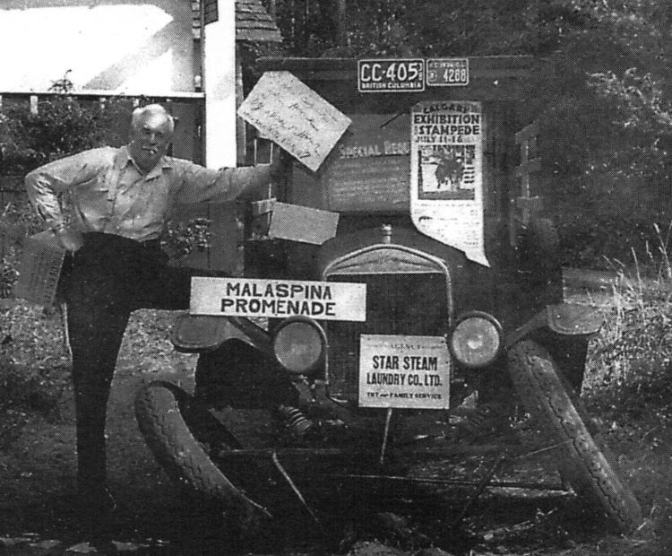 "Harry Keefer alongside the first motor vehicle on Savary, our [the Spilsbury's] Model T truck.  I must have backed over a stump or something, and the front wheels collapsed.  That's the store in the background." 
(Source: Spilsbury's Album by Jim Spilsbury, Harbour Publishing, 1990, www.harbourpublishing.com)
