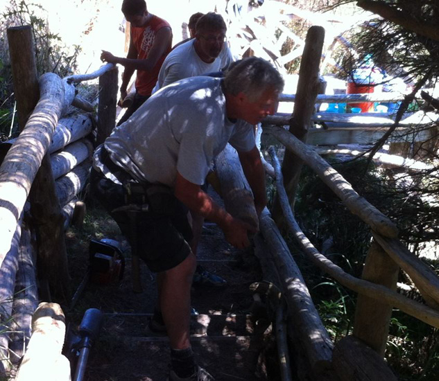 A work party upgrades the stairs in July 2015.  Pictured (front to back): Guy Belair, Randy Mottus, and Niko Mottus.